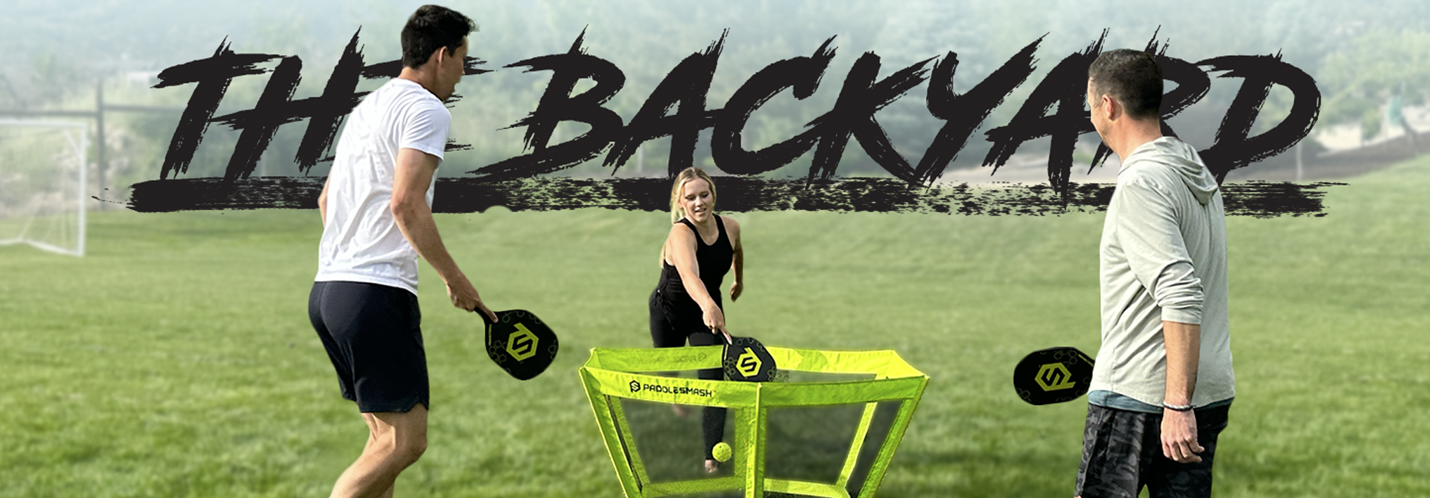 PaddleSmash players with paddles and net outdoors — Welcome to The Backyard blog